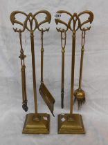 An old Art Nouveau brass two stand companion set