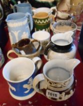 A quantity of 19th Century relief moulded jugs, mugs, etc.