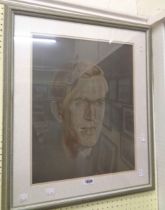 A framed muted coloured portrait print of a young man