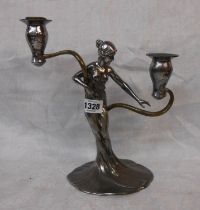 An Art Nouveau WMF silver plated twin branch candelabrum in the form of a maiden with flowing robes