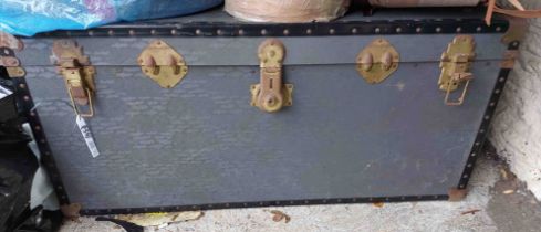 A vintage lift-top travelling trunk