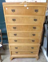 A 77cm reproduction walnut two part chest-on-stand with flight of seven long drawers, set on short