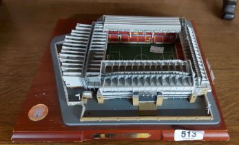 A resin model of Anfield, Liverpool FC's football ground, set on wooden base