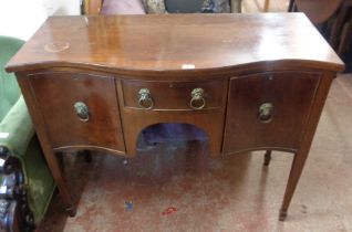 A 1.14m Georgian style mahogany serpentine front sideboard with lion mask ring handles to drawer and