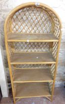 A 66cm modern wicker four shelf open bookcase with arched top