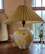 A ceramic table lamp of vase form, with transfer printed floral decoration - sold with shade