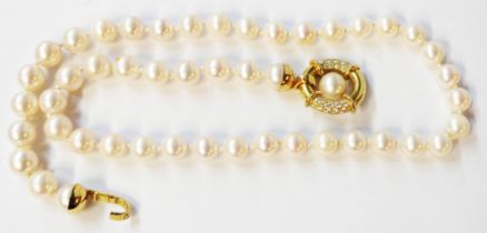 A Thurlwells single string uniform cultured pearl necklace with ornate high carat yellow metal