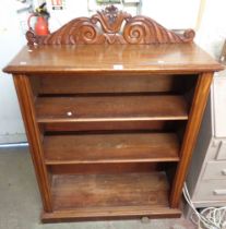 A 96cm Victorian mahogany three shelf open bookcase with decorative carved raised back, set on