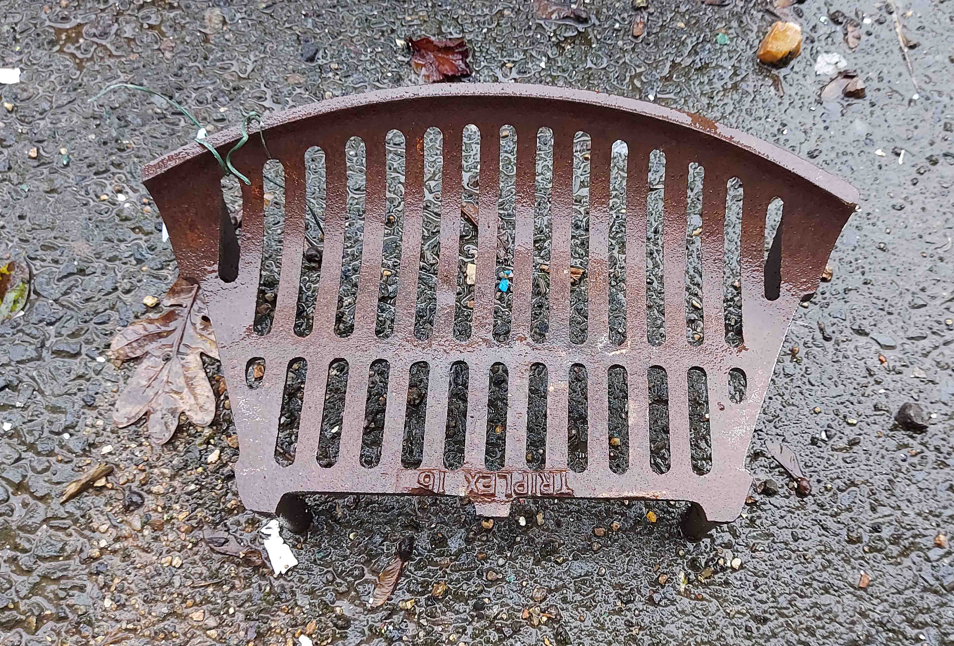 A small old cast iron fire grate