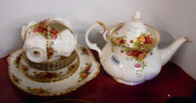 A Royal Albert Old Country Roses part tea set comprising teapot, four cups and saucers, three tea