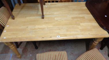 A 1.5m modern blonde wood kitchen table, set on turned legs - wear