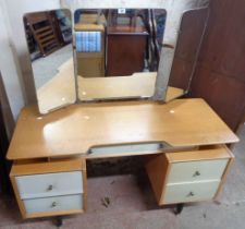 A 1.24m retro G-Plan part painted kneehole dressing table with triple mirror, frieze drawer and four