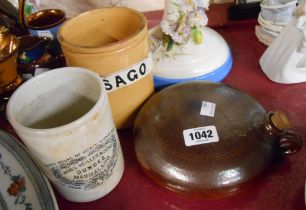 A salt glazed stoneware hot water bottle of flattened dome form - sold with an old Sago storage