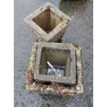 Three small similar concrete planters of square tapered form