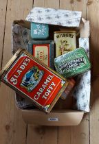 A box containing seven vintage collectable tins, including Slade`s Caramel Toffee, Wilkinsons