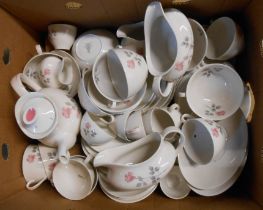 A box containing Royal Doulton bone china tea and dinner ware decorated in the Pillar Rose pattern