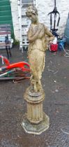 A 1.02m two part concrete statue of a classical maiden, set on a fluted plinth base