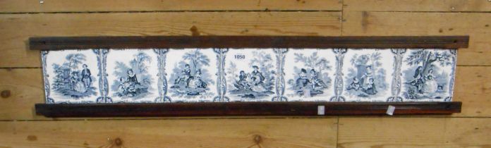 A set of seven 19th Century Mintons tiles each decorated with a transfer printed Watteau style scene