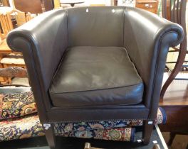 A 2015 Laura Ashley tub chair upholstered in studded dark brown leather, set on square tapered front