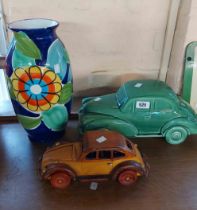 A large Dartmouth Pottery car model with green glaze finish, and a smaller wooden similar - sold