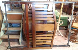 A 1.3m Edwardian mahogany and strung single bedstead comprising head and footboards and iron frame