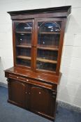 A VICTORIAN MAHOGANY BOOKCASE, with double glazed doors, over a base with a single drawer and double