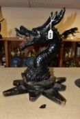 A CAST METAL DRAGONS HEAD AND NECK, mounted to an oak base, approximate height 39cm, there is