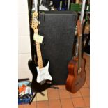 A SQUIER BY FENDER STRATOCASTER GUITAR with black body, white scratch plate, three single coil