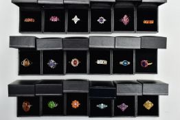 ASSORTED GEM SET RINGS, eighteen colourful gem set dress rings all set in white and yellow metal,