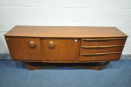 A MID CENTRUY BEAUTILITY TEAK SIDEBOARD, with three drawers and two cupboard doors, on a cross