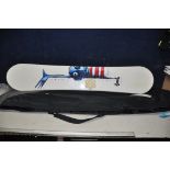 A MADHOUSE SNOWBOARD in a bag 160cm long (no boot clips)