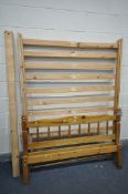 A PINE 4FT6 BEDSTEAD, bolts present (condition - minor damage)