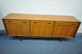A MCINTOSH AFROMOSIA TEAK CONCAVE SIDEBOARD, with three drawers, above two pairs of cupboard