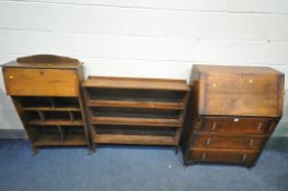 A 20TH CENTURY OAK BUREAU, with a fall front door, enclosing a fitted interior, above three drawers,