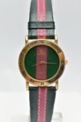 A 'GUCCI' QUARTZ WRISTWATCH, featuring a round green and burgundy stripped dial signed 'Gucci