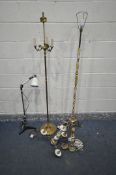AN ONYX AND BRASS STANDARD LAMP, a similar table lamp, along with a brass standard lamp, a triple