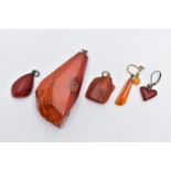 A NATURAL AMBER PENDANT, a large polished natural amber pendant, approximate length 59mm,