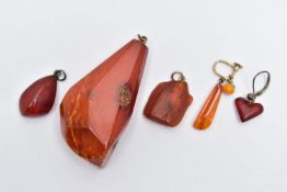 A NATURAL AMBER PENDANT, a large polished natural amber pendant, approximate length 59mm,