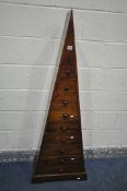 A HARDWOOD PYRAMID SHAPED CHEST OF NINE VARIOUS DRAWERS, width 56cm x depth 28cm x height 148cm (