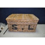 A WICKER HAMPER WITH S.L. STENCILLED TO FRONT, width 75cm x depth 54cm x height 39cm