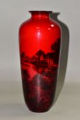 A ROYAL DOULTON FLAMBÉ BALUSTER VASE, decorated with a pastoral scene, of a cottage and fields by