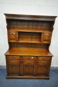 A ROYAL OAK FURNITURE COMPANY, BALMORAL COLLECCTION, A PERIOD STYLE OAK DRESSER, the top with an