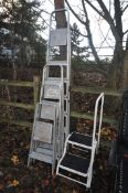 FOUR VARIOUS SIZES ALUMINIUM STEP LADDERS, and a set of library steps (5)