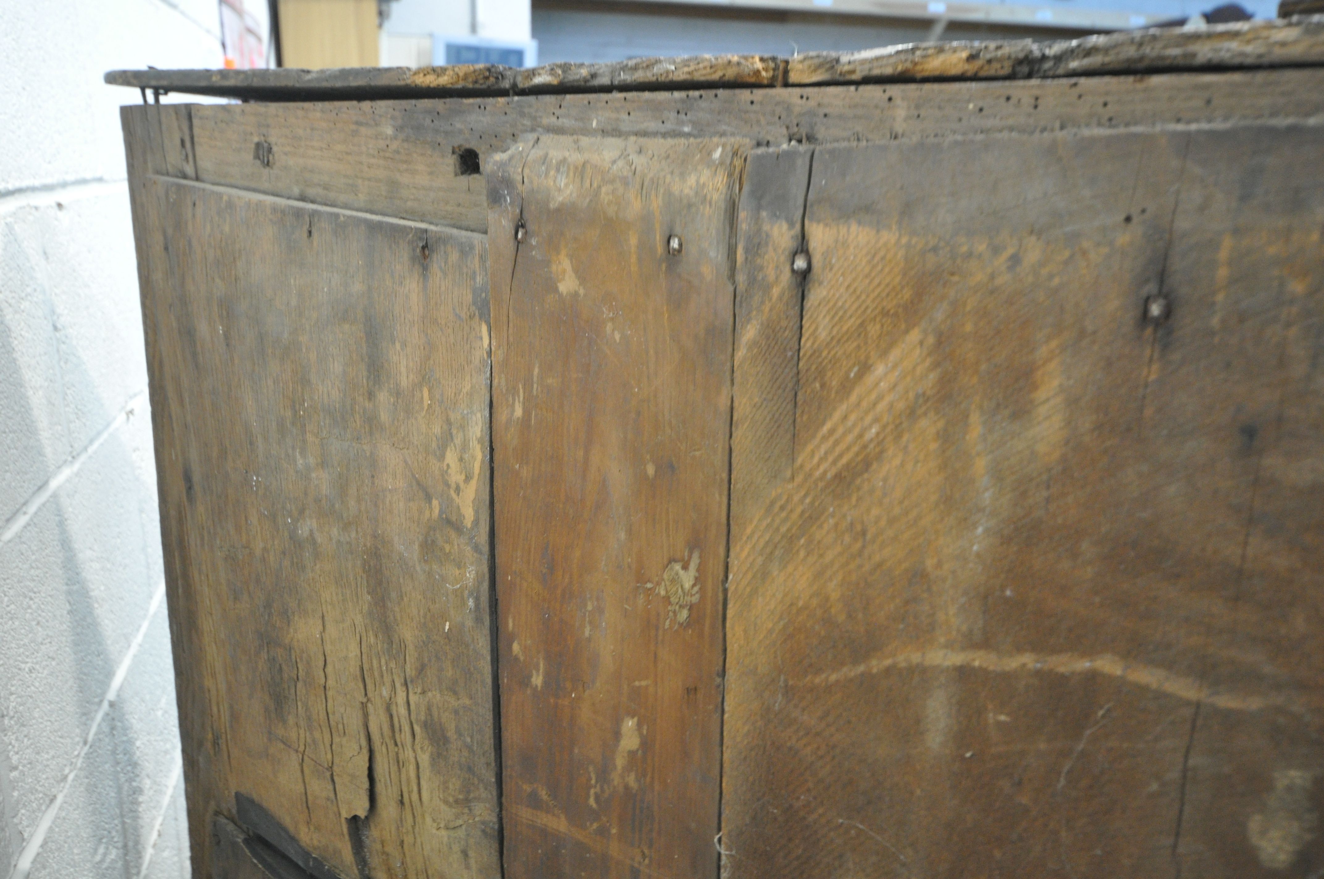 A 17TH CENTURY JOINED OAK CUPBOARD, with a carved top rail, and initialled I.H.E, the double doors - Image 7 of 9