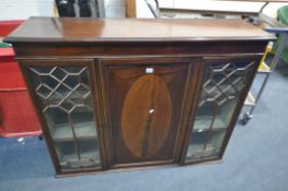 AN EDWARDIAN MAHOGANY BOOKCASE TOP, with two glazed doors flanking a single cupboard door, width