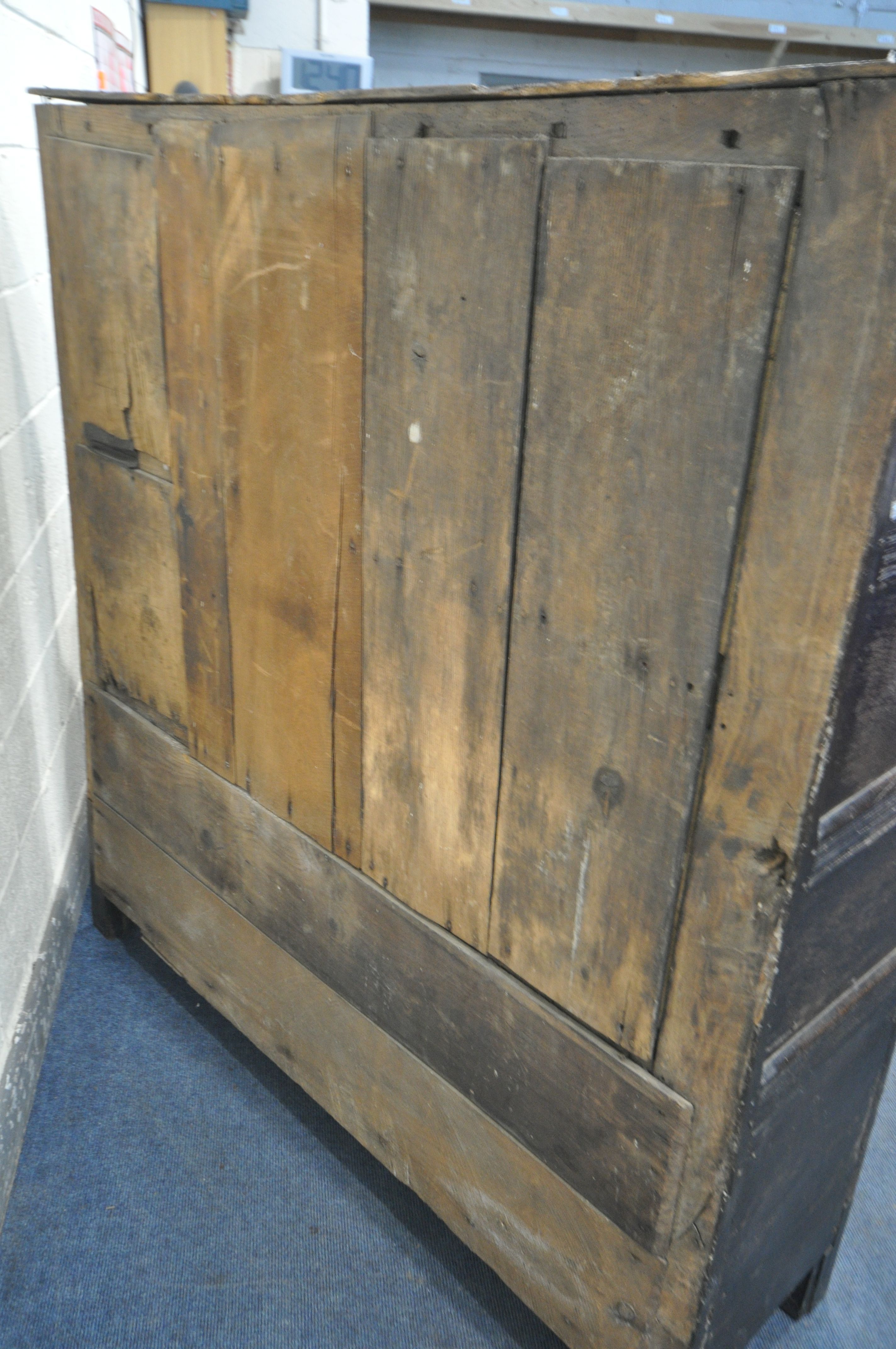 A 17TH CENTURY JOINED OAK CUPBOARD, with a carved top rail, and initialled I.H.E, the double doors - Image 6 of 9