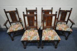 A SET OF SIX OLD CHARM OAK DINING CHAIRS, including two carvers, with a floral seat pad (