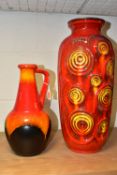 A BAY WEST GERMAN FAT LAVA BALUSTER VASE AND BAY FAT LAVA EWER, the red ground vase with textured