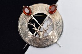 A LARGE SILVER 'WARD BROTHERS' SCOTTISH BROOCH, of an openwork circular form, displaying a stag head