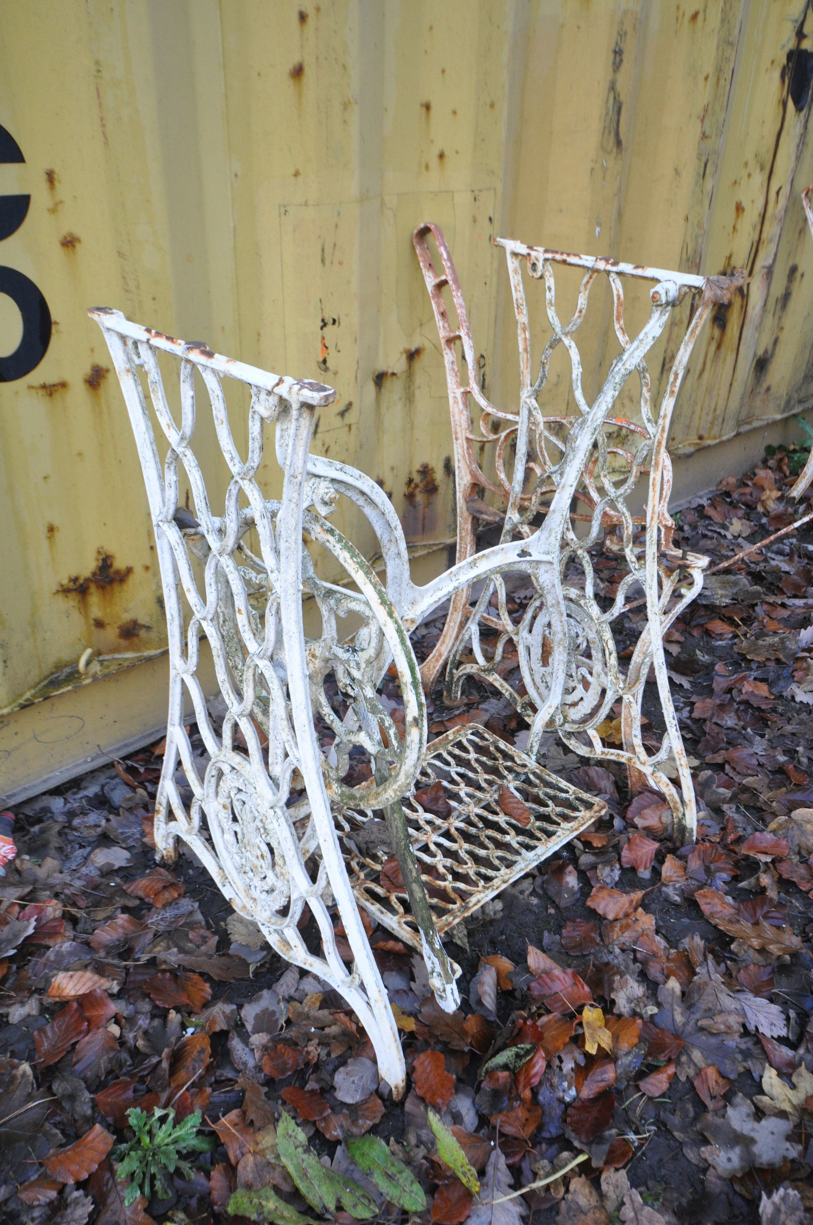 A WROUGHT IRON GARDEN BENCH (no slats) and a treadle sewing machine base (2) - Image 2 of 2